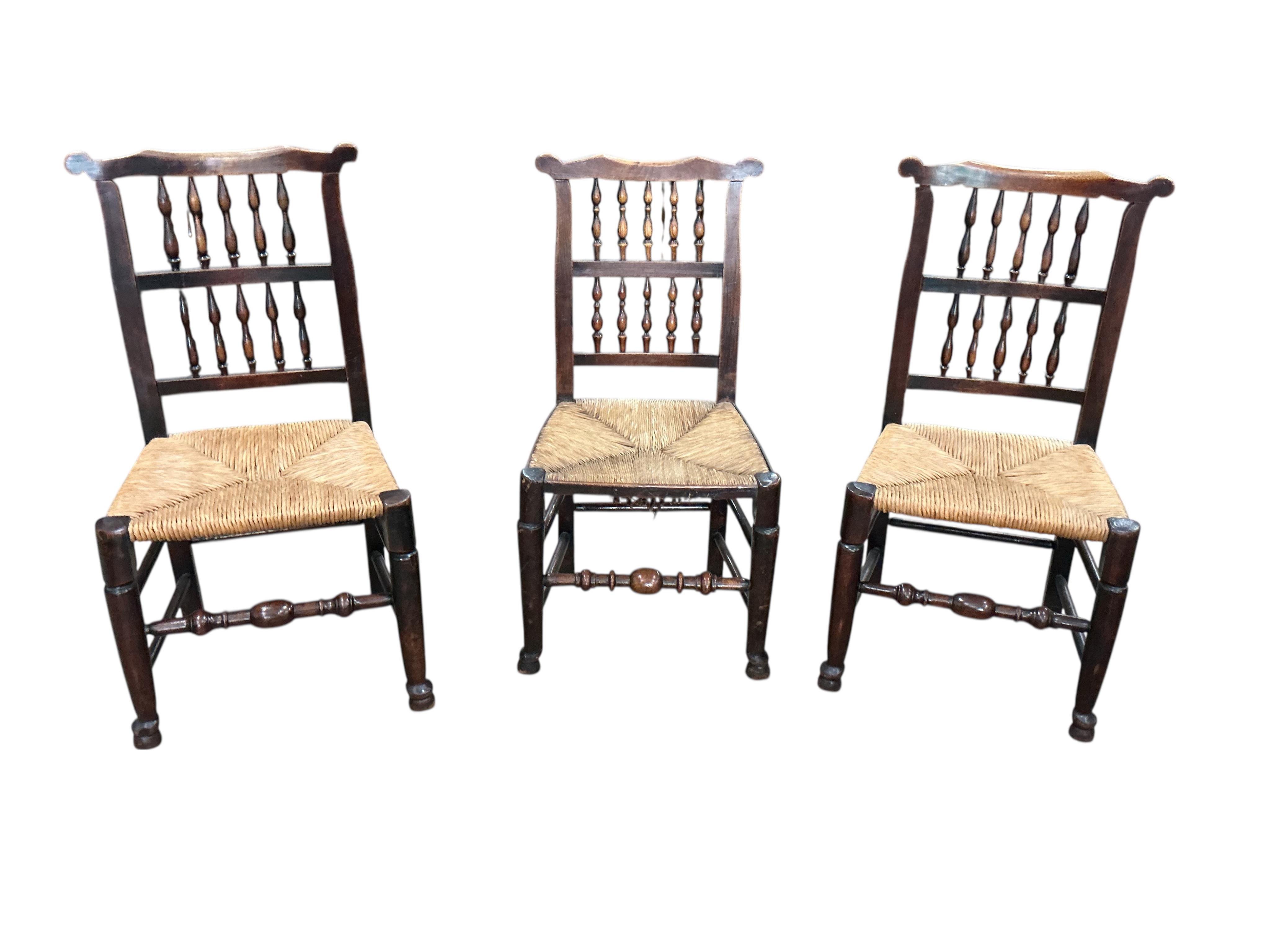 A harlequin set of six 19th century Lancashire beech and fruit wood rush seat dining chairs